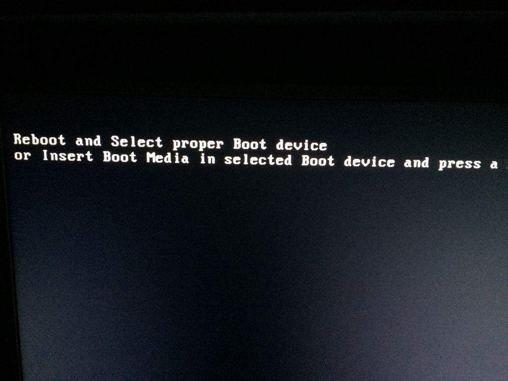 重启电脑出现Reboot and select proper Boot device怎么办